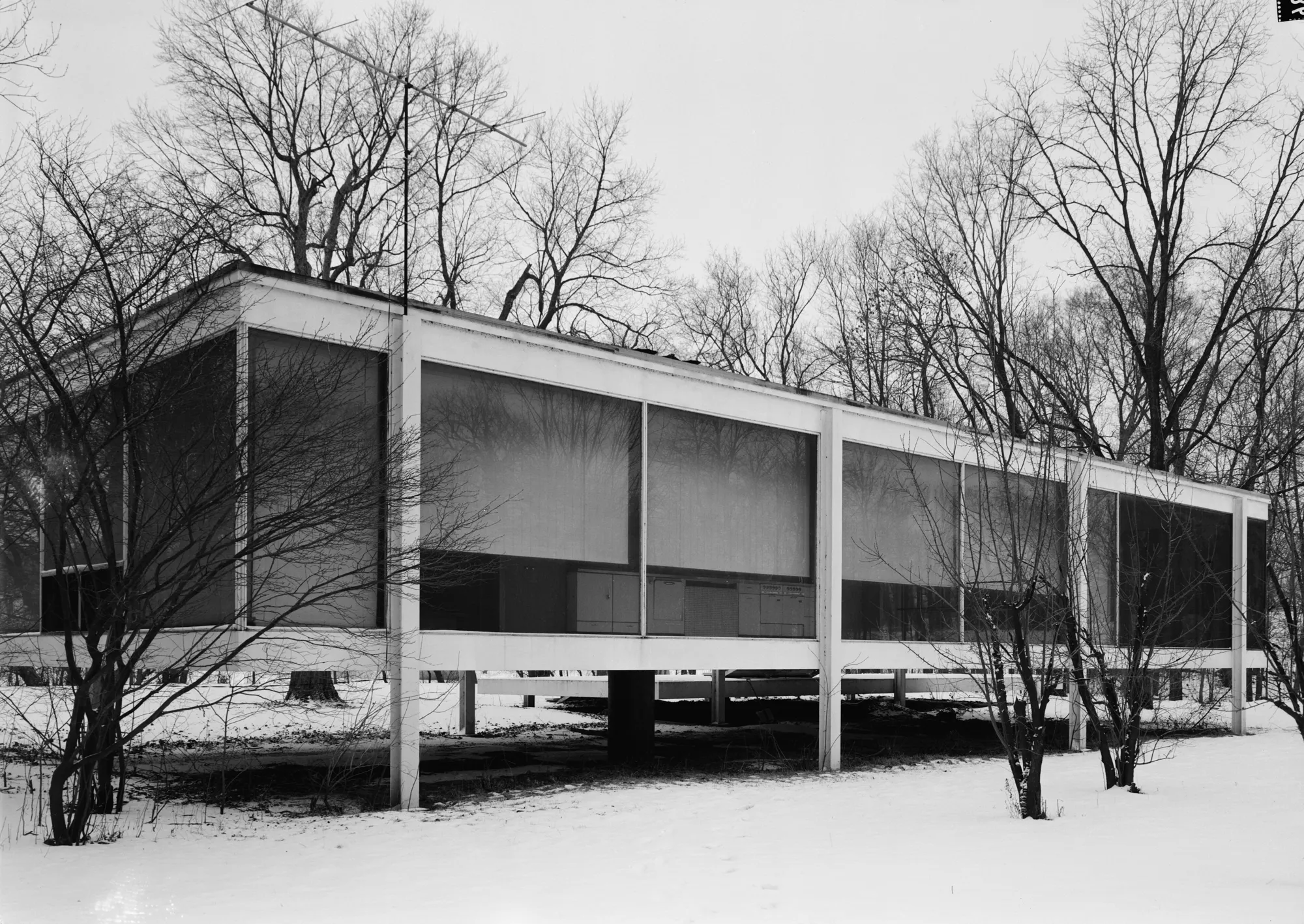 The north side of the Farnsworth House with its entrance terrace and steps, seen from the northeast.