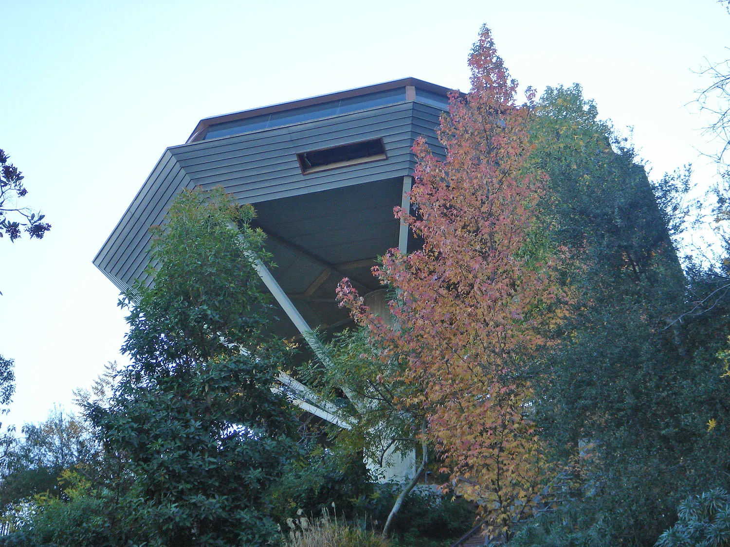 The Chemosphere seen from below, its octagonal body above the hillside.