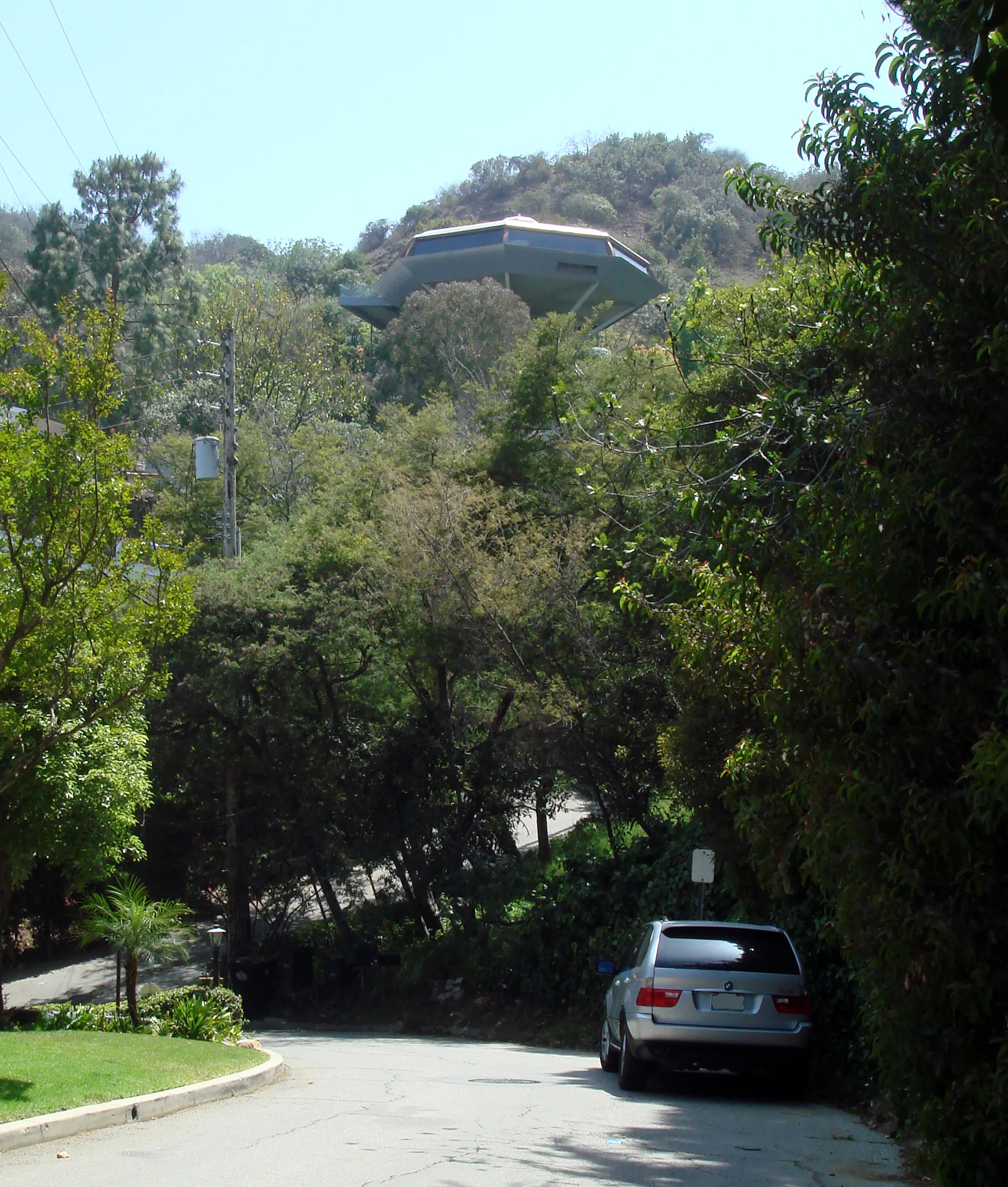The Chemosphere from street level, with the driveway in the foreground.